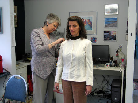 Fitting the muslin for a couture jacket.