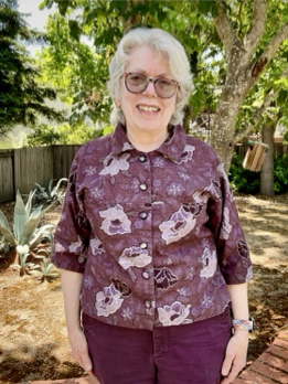 Keren wearing a blouse