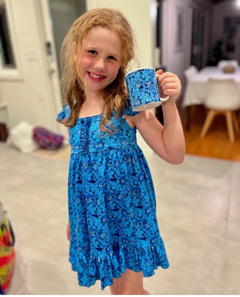 Ella wearing a dress made from Jane’s plumbago design fabric