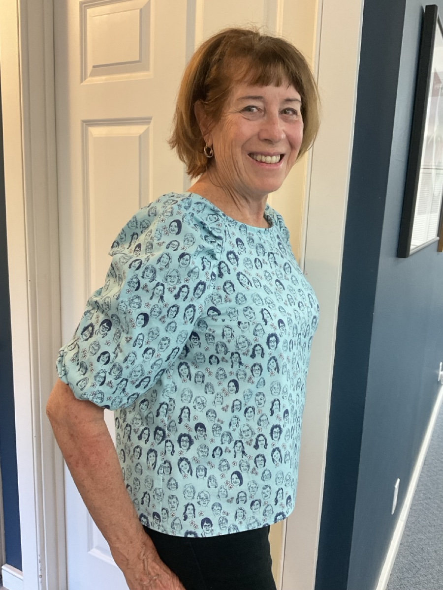 Susan Lucchesi wearing a top made from Jane’s faces fabric