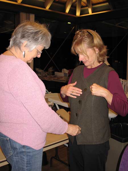 Maria sews a vest